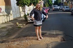 Foto mostra como estava o asfalto na região antes de o pedido de Coronel Adriana ser atendido